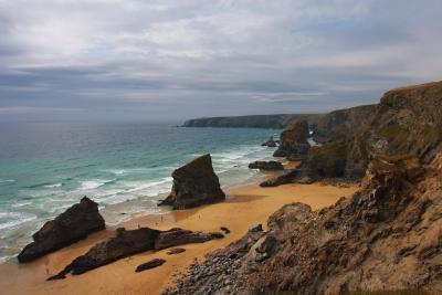 Bedruthan Steps from the cliff top, with a storm brewing out to