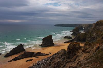 Bedruthan Steps from the cliff top, with a storm brewing out to