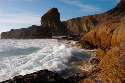 Waves breaking on the shoreline at Bedruthan Steps