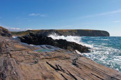 Waves breaking on the rocks at Will's Rock near Portcothan on th