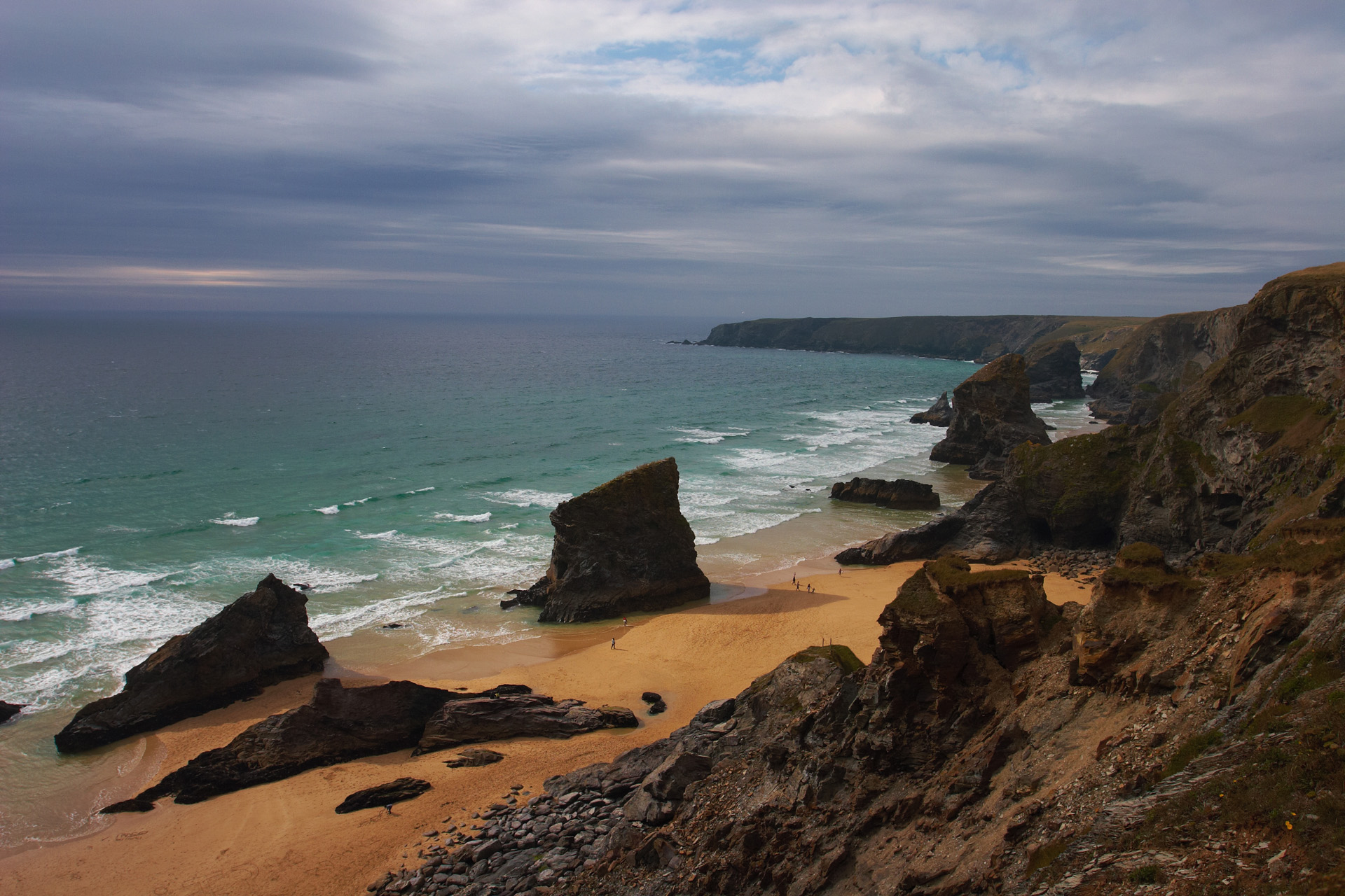 Bedruthan Steps from the cliff top, with a storm brewing out to