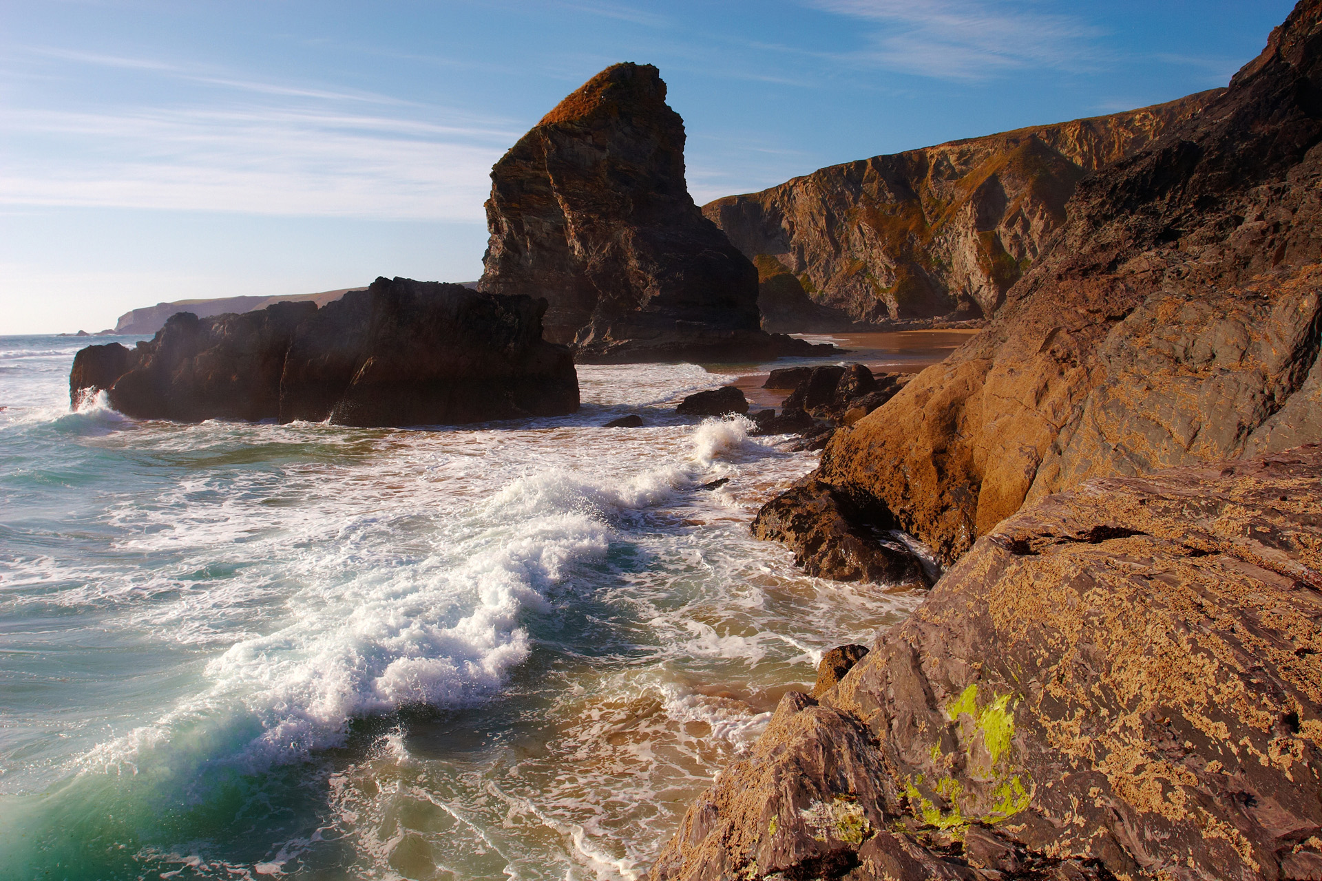 Waves breaking on the rocky shore at Bedruthan Steps