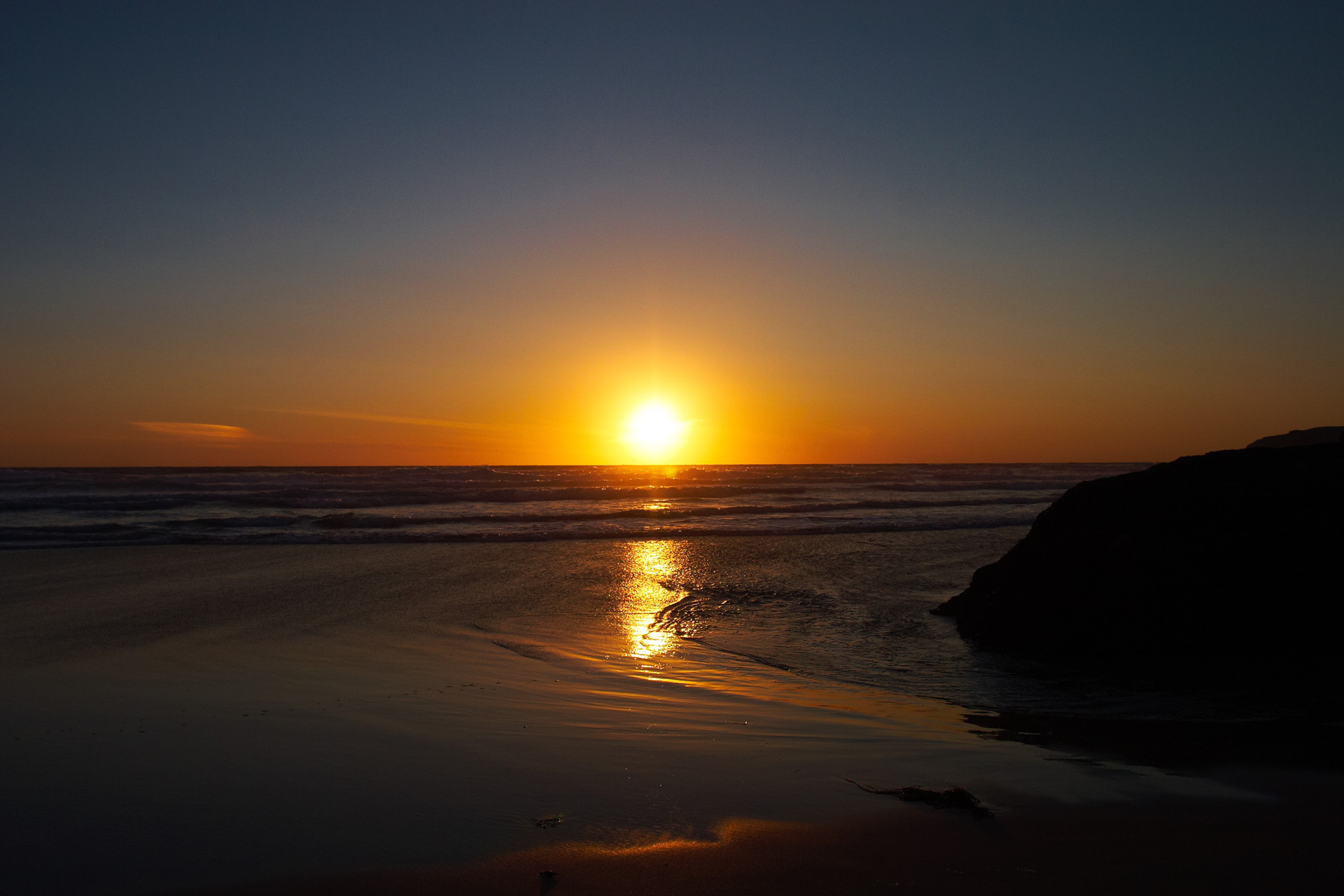 Sunset on the beach at Bedruthan Steps in Cornwall