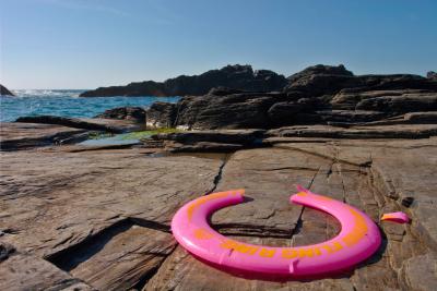 Abandoned Frisbee on the rocks at Will's Rock near Porthcothan i